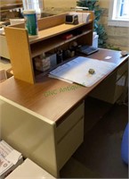 Beige colored secretary desk with shelving unit -