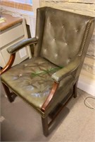 Vintage green leather-like wooden arm chair in