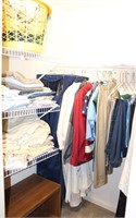 CONTENTS OF CLOSET W/ WOMENS CLOTHING & SHEETS