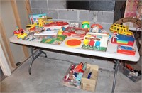TABLE LOT OF VINTAGE FISHER PRICE TOYS