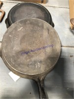 PAIR OF CAST IRON SKILLETS