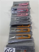 new tailor cutting scissors and sewing needles