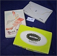Three boxes containing new sheer stockings