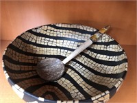 International striped bowl with spoon.