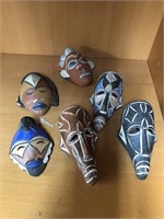 Clay passport mask made in Cameroon.