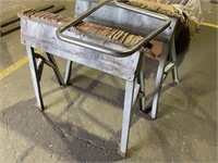 Two metal sawhorses with wooden top, metal