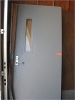Metal fire door with glass strip