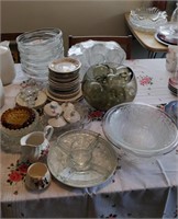 lot of glassware , plates , ash trays , platters