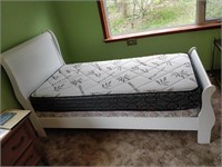 single bed with boxspring and mattress