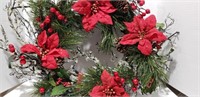 Christmas wreaths, bows and poinsettia bushes