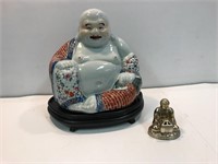 Porcelain and a brass Buddha.