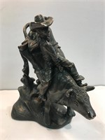 Bull rider. 12” tall. Has been repaired