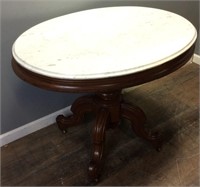VTG. MARBLE TOP OVAL TABLE ON WHEELS