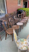 Lot of 6 Round vac wood chairs one without a seat