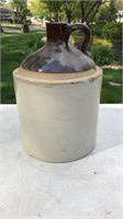 Brown topped stoneware jug/crock-has a chip and