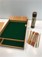 Wooden pick up sticks and board game.