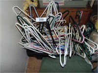 Plastic Basket of Coat Hangers