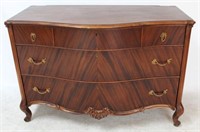 Carved Bow Front Book Matched Mahogany Chest
