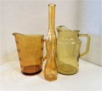 Amber glass vase and pitchers