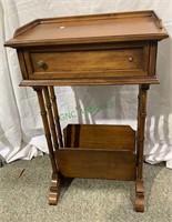 Small Brent Furniture side table with magazine