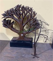 Carved wood tree sculpture and a twisted copper