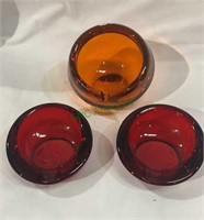 2 cherry red and 1 orange glass ashtrays - orange