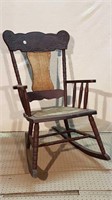 ANTIQUE ROCKER WITH ARMS