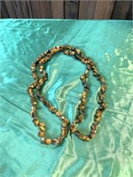 Long strand of tiger eye stone necklace