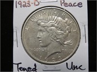 1923 D PEACE SILVER DOLLAR 90% (TONED) UNC