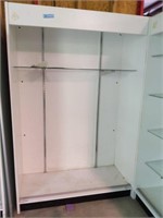 White display case with doors not installed