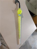 chartreuse umbrella in plastic casing