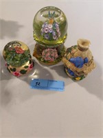 Two snow globes and glass birdhouse figurine