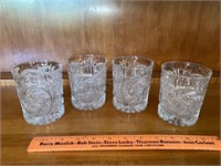 4 matching crystal glasses. 1 has chipped rim