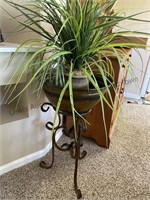 Nice artificial plant on stand.