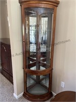 Beautiful corner curio. 75.5” h. Lighted and in