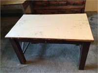 Table. Linoleum over wood
