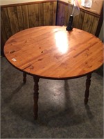 Wooden round table. No chairs