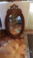 Oval wooden framed mirror