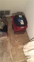 Boxes on floor in small bedroom and items on
