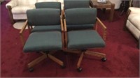 Group of 4 wood cloth chairs on rollers