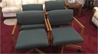 Group of 4 wood cloth chairs on rollers