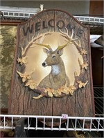 welcom sign with whitetail deer