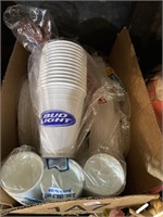 Plates and plastic cups, a pack of bud light cups