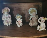 4 Ceramic Doll Figurines