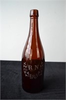 Amber bottle with R.N. Etching
