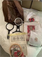 Needlepoint items in a bag