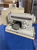Kenmore sewing machine with attachments