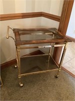 Beverage cart with brass frame and glass insert
