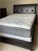 Queen-size bed with mattress and box spring