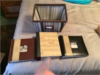 3 blank photo albums and a storage basket